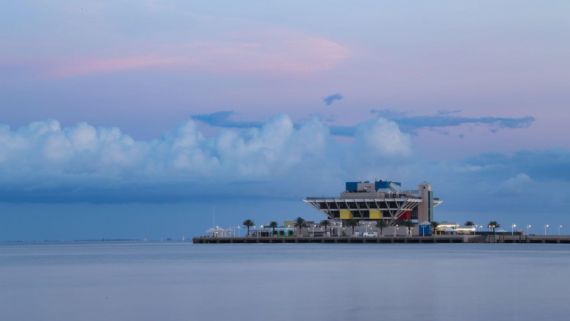 Twilight view of the iconic St. Pete Pier with calm water reflections in St. Petersburg, Pinellas County, Florida